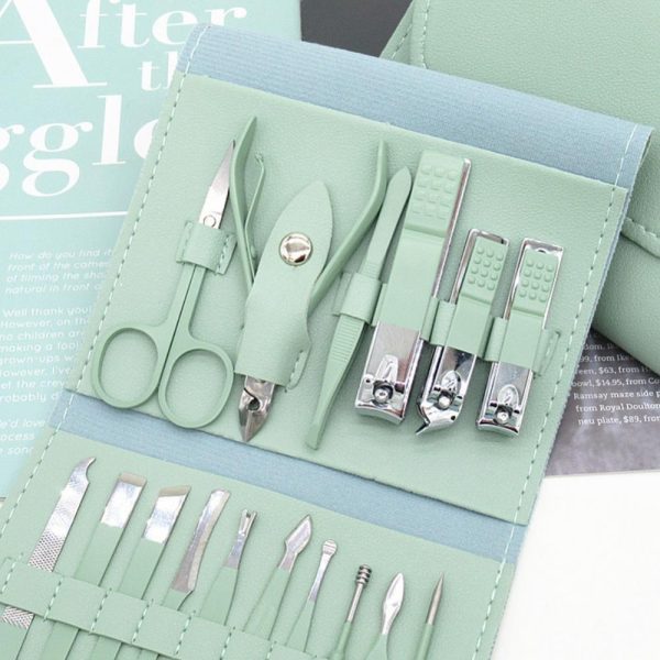 Mint green manicure set with tools on a light blue background
